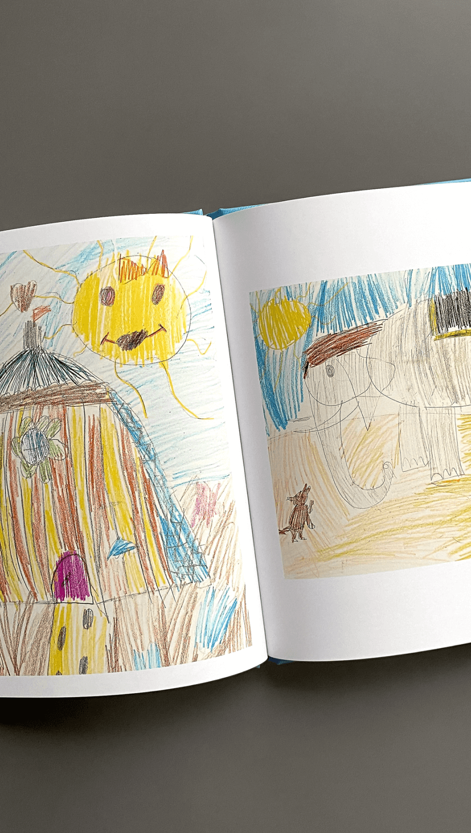 Photo book builder for children's crafts and drawings.